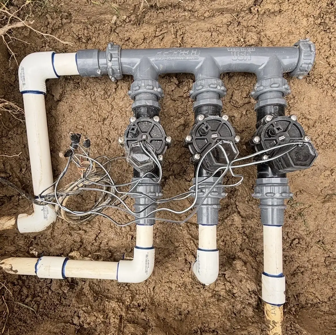 New sprinkler valve manifold with three valves before burial